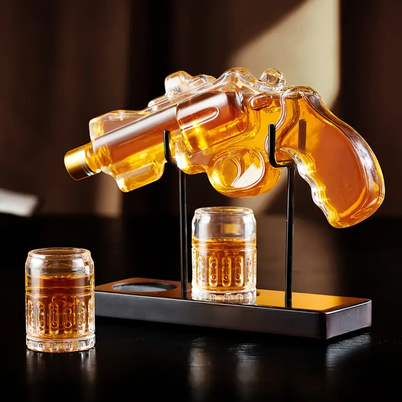 Unique pistol-shaped glass hip flask. Polished metal surface, high-end decanter, perfect choice for home bar, gift for boyfriend, father